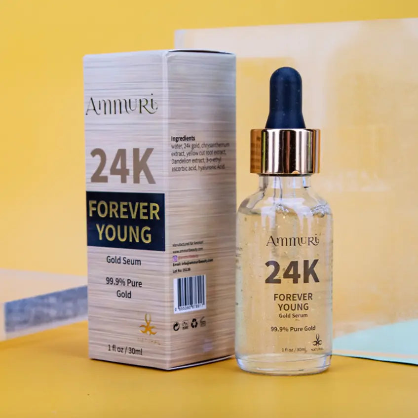 Ammuri Beauty 24K gold face serum in a glass bottle next to its stylish box on a yellow background