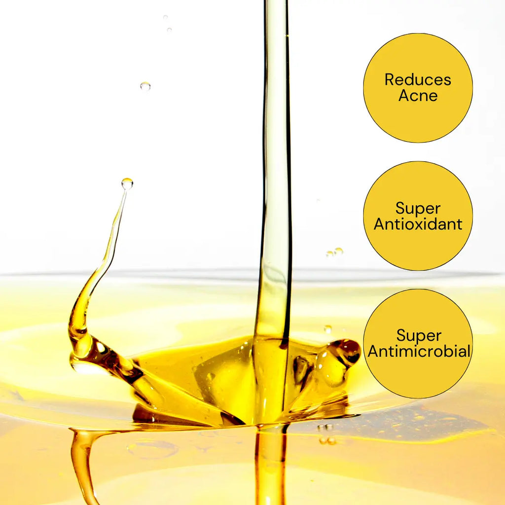 Ammuri Skincare organic black seed oil in a clear bottle highlighting its acne-reducing properties