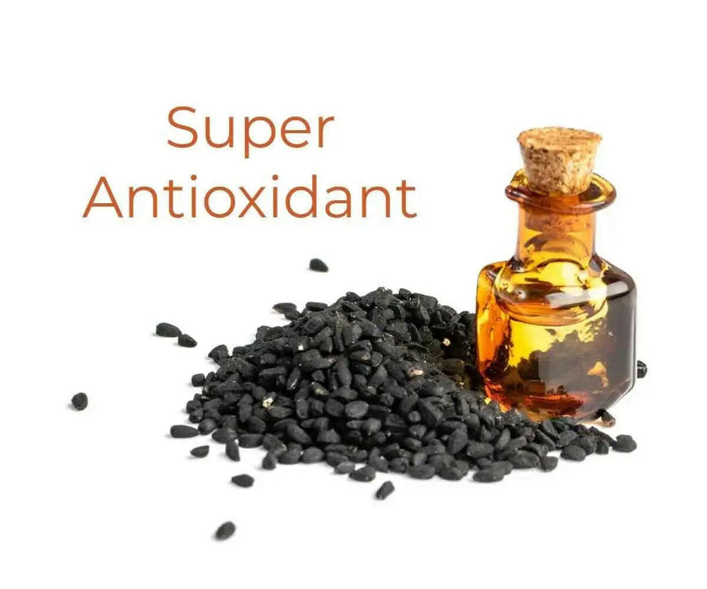 Ammuri Skincare organic black seed oil in a glass bottle surrounded by black seeds, highlighting its antioxidant properties