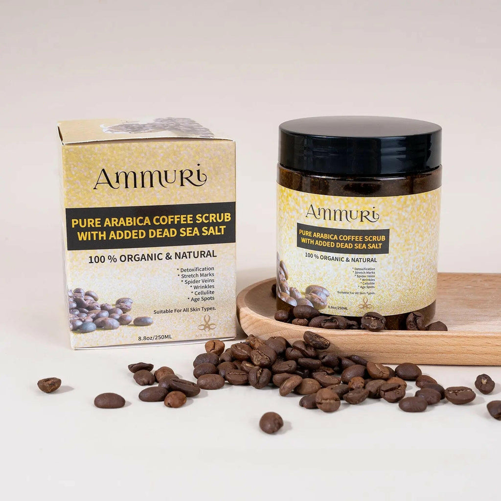 Ammuri Skincare Organic Coffee Scrub for Skin in jar with coffee beans and packaging on a wooden tray