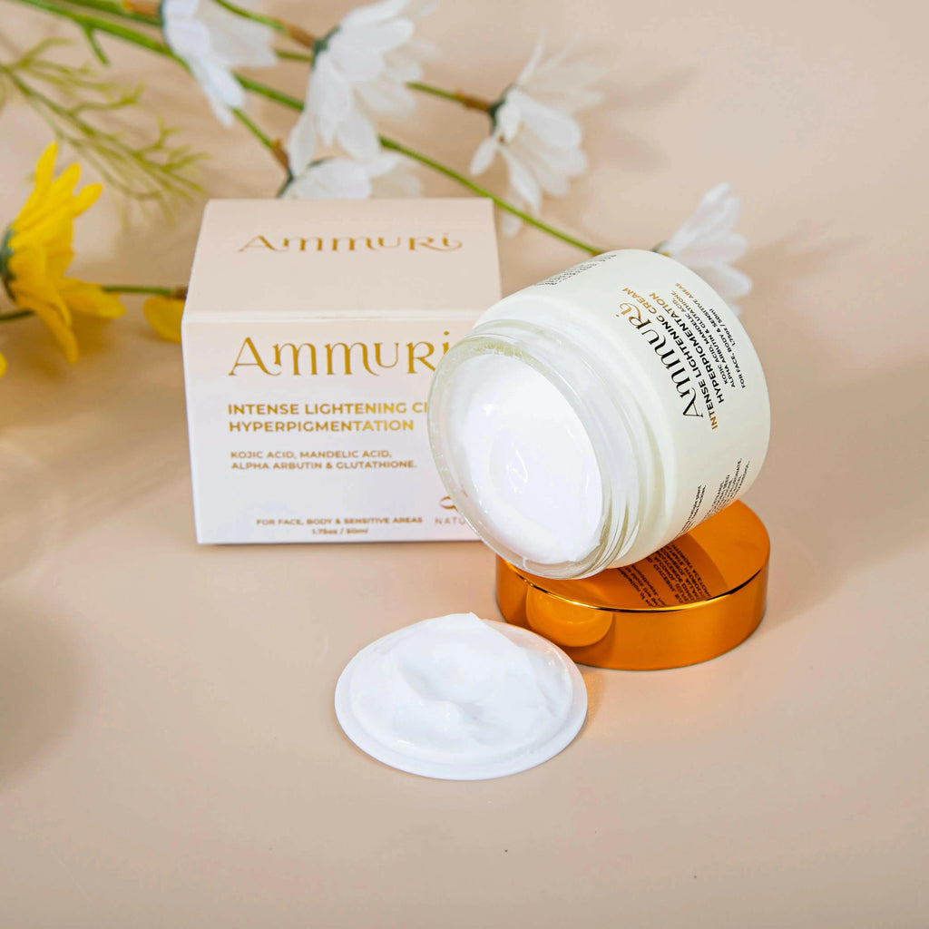Ammuri Beauty Intense Lightening Skin Cream for Dark Spots in a jar with fresh floral background