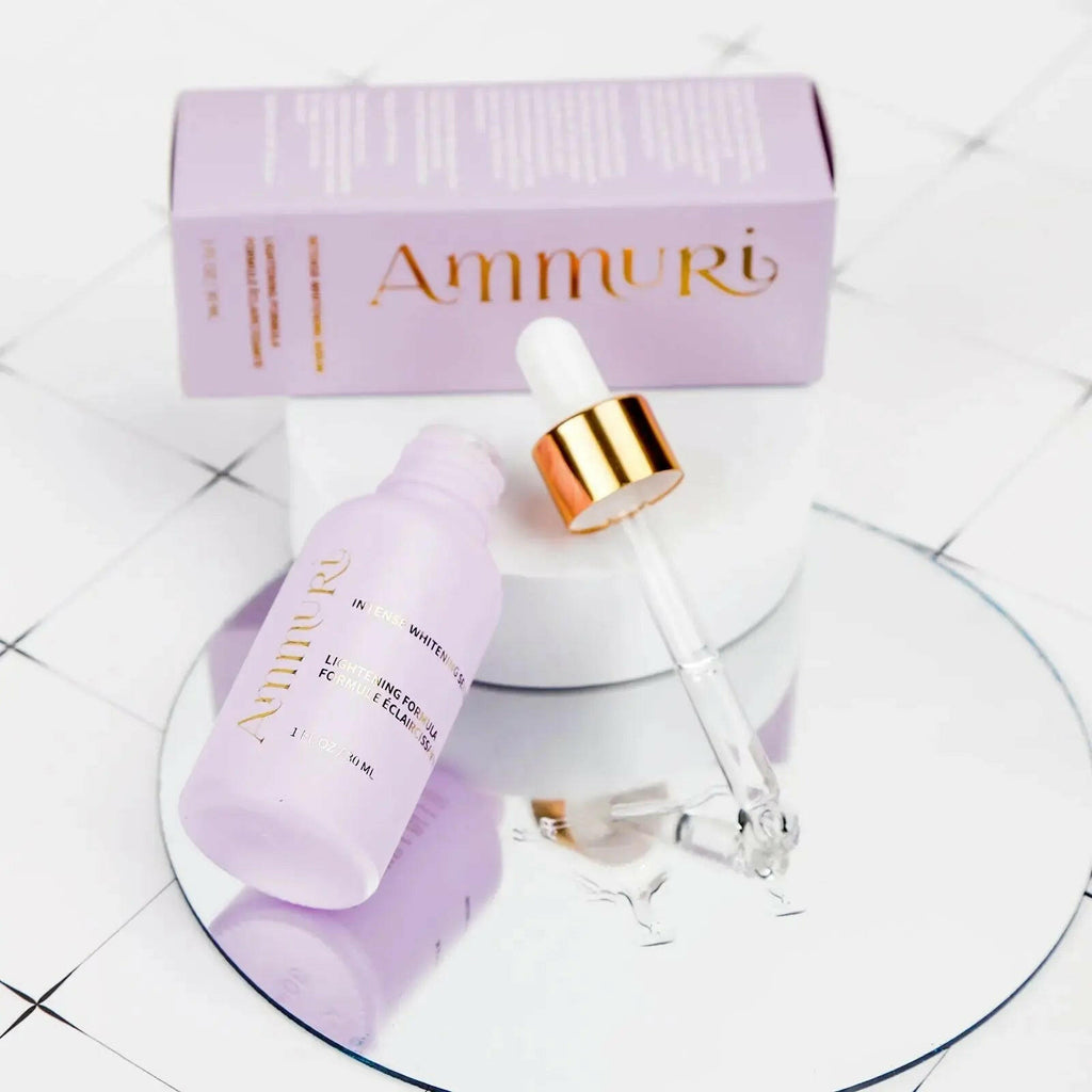 Ammuri Skincare Whitening Lightening Serum in a purple bottle with dropper on a reflective surface