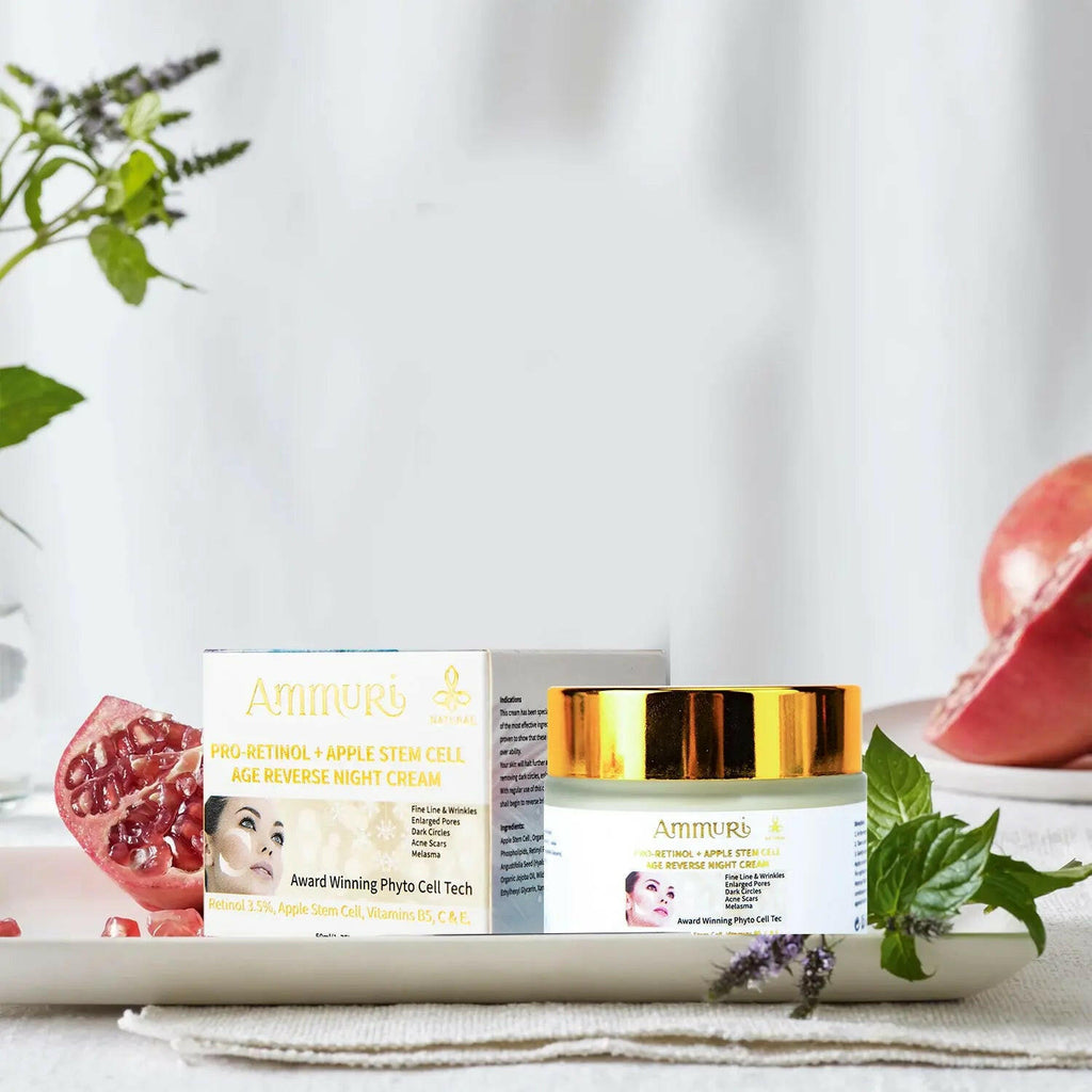 Ammuri Skincare retinol apple stem cell cream in a jar with a box on a white table with fruits