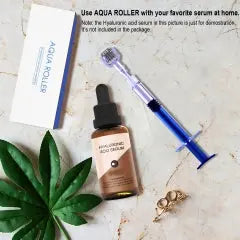 Ammuri Beauty Anti Ageing Serum with microneedling serum roller on a marble background